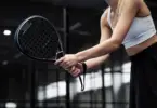 Stock photo of a woman playing pickleball.