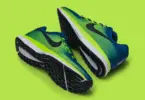Nike basketball shoes in lime green and blue, lying on a lime-green background.