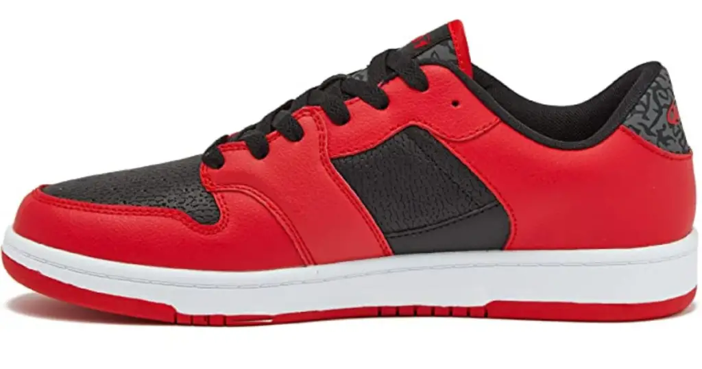 Profile pic of the low-top AND1 Slam Men's Basketball Shoe, red with black details on the front and a panel on the side, with a white sole.