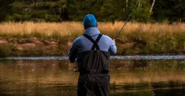 Man wearing the best chest waders while fly fishing