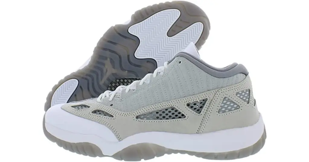 Product photo of Jordan 11 Retro Low basketball shoes, all gray in varying shades with cutouts on sides and white and gray sole.