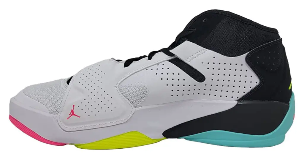 Product photo of the Jordan Zion 2 basketball shoe, white with black heel and interior, with pink, yellow, and teal sole.