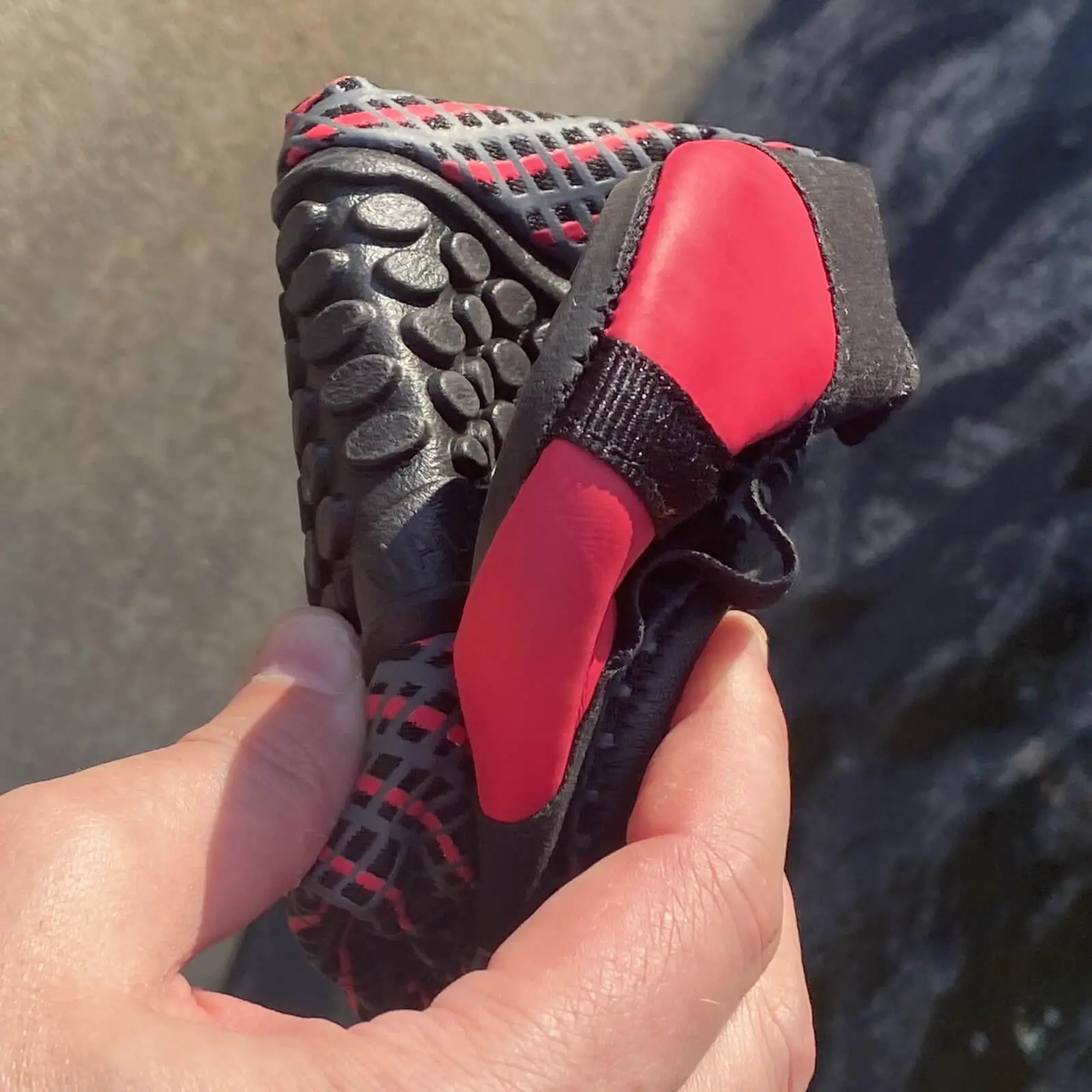 Folded up L-Run water shoe showing thinness and flexibility of the sole and upper