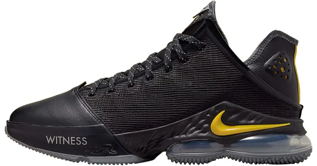 Product photo of Nike LeBron 19 basketball shoe, black with yellow Nike swoosh on side of the heel.