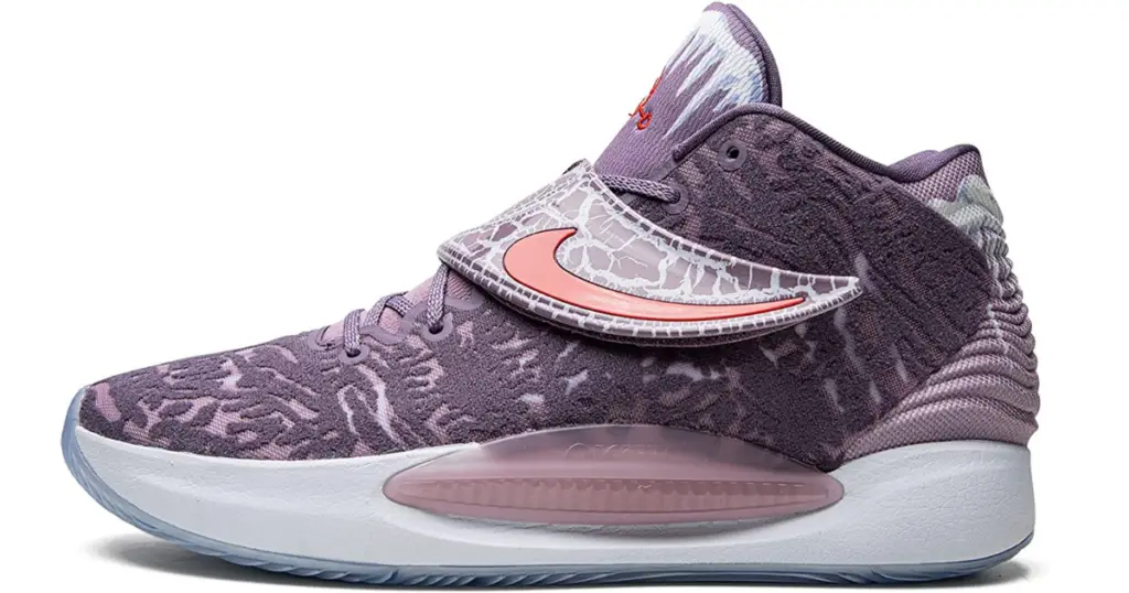 Closeup of Nike KD 14 basketball shoe, light purple with white sole, and salmon-colored Nike swoosh.