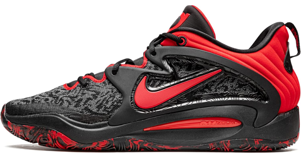 Red and black basketball shoe with gray marble on the sides, red Nike swoosh, and marbled black/red sole.