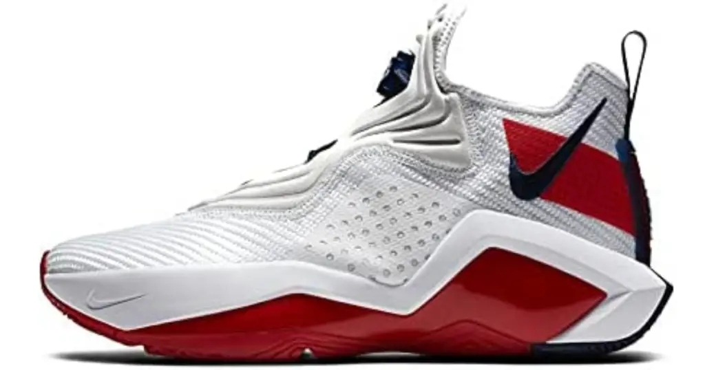 Closeup of single Nike Men’s Lebron Soldier XIV 14 Basketball Shoe, white with black Nike swoosh against red rectangle, and red and white sole.