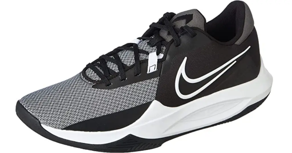 Product photo of Nike Precision 6 basketball shoe, black with white Nike swoosh on the side and white sole.