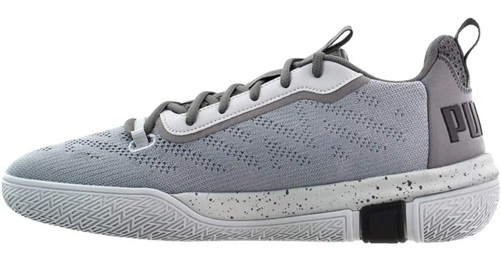 Profile pic of the PUMA Mens Legacy Low Basketball Shoe, light gray with PUMA on the back heel.