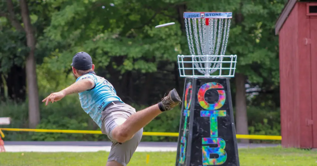 Stock photo of a man playing disc golf.