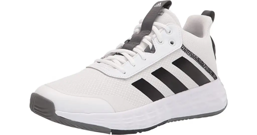 Product photo of Adidas Men's Own The Game 2.0 basketball shoe, white with large black Adidas logo on side and gray bottom sole.