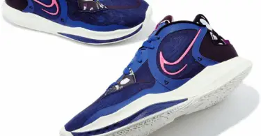 Two blue basketball shoes with Nike swoosh in pink on the side, one in profile in center, one half-visible on top left.